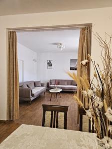 a living room with a couch and a table at Apartments Nadja in Kotor