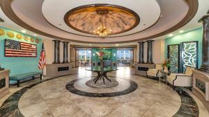 a lobby with a table in the middle of a room at Lakefront 3rd floor condo at River Strand Golf and Country Club in Bradenton +58 photos