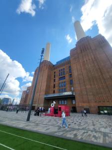 a large building with people walking in front of it at Marvellous property for 8 people in Battersea - Zone 1, 3 min walking from the main Station in London