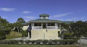 a large white house with a porch and stairs at Lakefront, Private Pool, Irynas Dream in Bradenton
