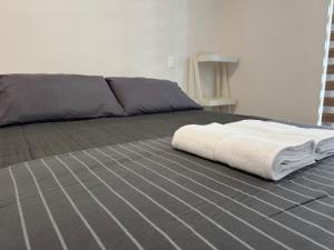 Ένα ή περισσότερα κρεβάτια σε δωμάτιο στο Edificio Claro Solar - Moderno Apartamento Centro Temuco