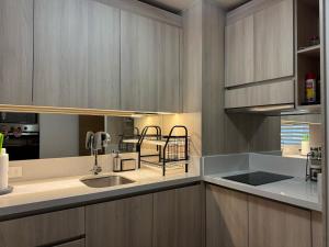 Η κουζίνα ή μικρή κουζίνα στο Edificio Claro Solar - Moderno Apartamento Centro Temuco +11 φωτογραφίες