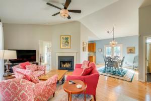 a living room with red furniture and a fireplace at Private Deck and Views Rural Virginia Escape in Gordonsville