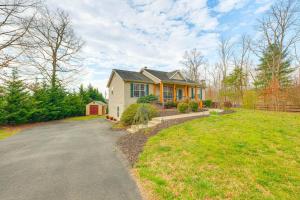 a house with a driveway in front of a yard at Private Deck and Views Rural Virginia Escape in Gordonsville