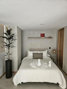 En eller flere senge i et værelse på 2402 Luxury apartment in Sabaneta