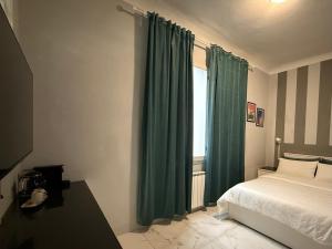 Posteľ alebo postele v izbe v ubytovaní San Frediano Boutique