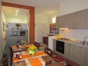 a kitchen and a dining room with a table and a kitchen at B&B Eco Dal Mare in Gallipoli