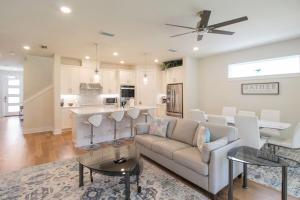a living room with a couch and a table at Modern 4 BR home in the heart of Sarasota in Sarasota