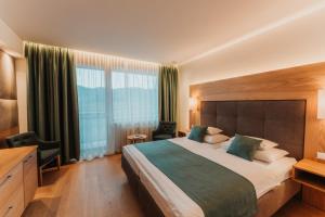 Voodi või voodid majutusasutuse Wilfinger Ring Bio Hotel toas