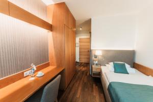 Voodi või voodid majutusasutuse Wilfinger Ring Bio Hotel toas