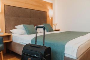 Voodi või voodid majutusasutuse Wilfinger Ring Bio Hotel toas