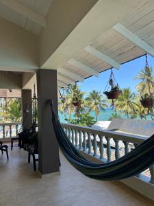 a hammock in a room with a view of the ocean at Casa MIA in Cabarete