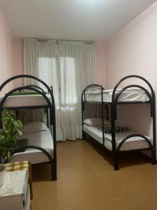 Postel nebo postele na pokoji v ubytování FAMAGOSTA Home