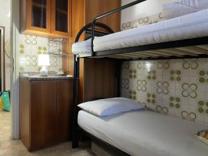 Postel nebo postele na pokoji v ubytování FAMAGOSTA Home