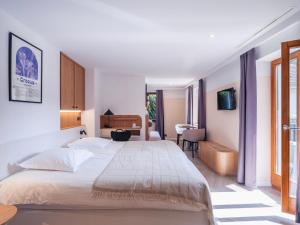 Postel nebo postele na pokoji v ubytování Hotel Au Vieux Moulin