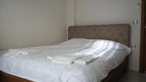 En eller flere senge i et værelse på Ege Apartments