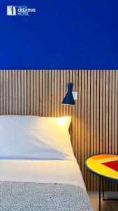 Giường trong phòng chung tại Hotel Nizza Creative Hotel