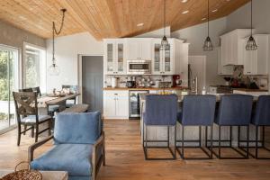 a kitchen and living room with a table and chairs at Old Town Farm-to-Table Home - Gourmet Adventure with Pool in Scottsdale