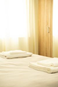 Ένα ή περισσότερα κρεβάτια σε δωμάτιο στο Bonki Apartment