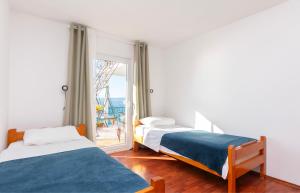 Postel nebo postele na pokoji v ubytování Apartments Zorica