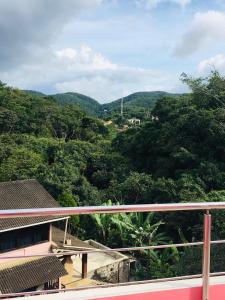 a view of a mountain with trees and a house at Casa da Barbie da Serra in Pacoti +34 photos