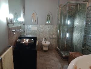 a bathroom with a shower and a toilet and a sink at buon Talenti House in Florence