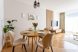 a dining room with a table and chairs at Wohlfühl-Maisonette mit Blick auf die Therme in Bad Saarow