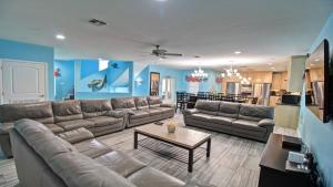 a living room with a couch and a table at 100Ft To Beach,Beachview,EV charger,Heated Pool,Jacuzzi in South Padre Island