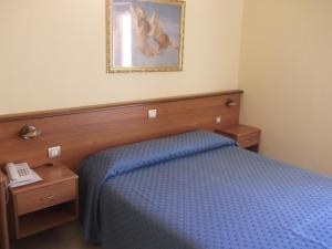 Postel nebo postele na pokoji v ubytování Hotel Il Vulcano