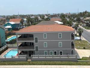 a large apartment building with a swimming pool at 100Ft To Beach,Beachview,EV charger,Heated Pool,Jacuzzi in South Padre Island