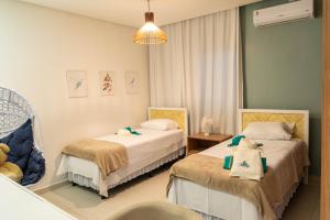 Katil atau katil-katil dalam bilik di Mansão pontal beach +90 gambar