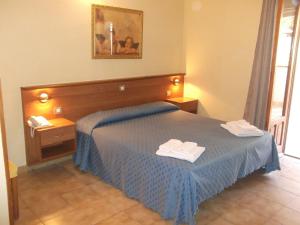 Postel nebo postele na pokoji v ubytování Hotel Il Vulcano