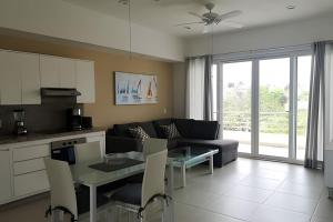 a living room with a couch and a table at Departamento Hanna #2 Bucerias in Bucerías