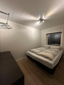 Ένα ή περισσότερα κρεβάτια σε δωμάτιο στο Apartment in the city center of Tromsø +12 φωτογραφίες