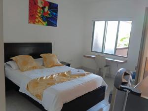 Postel nebo postele na pokoji v ubytování Hotel Zenit de colombia + 24 fotografií