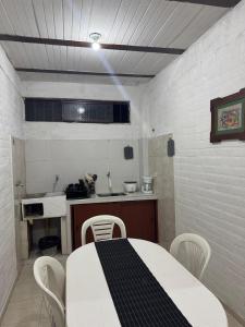 a kitchen with a table and chairs in a room at Acogedor Aparta Estudio Central Interior 101 in Popayan