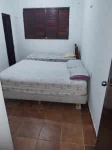 Cama ou camas em um quarto em Aconchego Suítes
