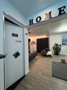 a room with a door and a room with a bed at Escape Serenity Suite Haut de Gamme in Nevers