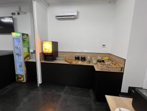 a counter with food on it in a room at Hotel Le royal in Tulle