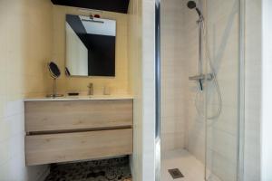 a bathroom with a shower and a sink and a mirror at La Marine, maison en plein cœur de Wimereux in Wimereux +33 photos