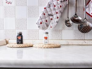 two bottles of wine sitting on top of a kitchen counter at Domus Albano laziale in Albano Laziale +26 photos