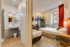a hotel room with two beds and a sink at Seven in Rome +97 photos