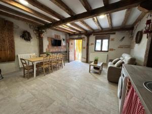 a large living room with a table and chairs at FINCA ENTREVIÑEDOS de Bodegas Marcos in Peñafiel