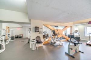 a gym with treadmills and machines in a room at Luxe High-Rise 2 Mi to Dtwn Cleveland WFH Ready! in Cleveland