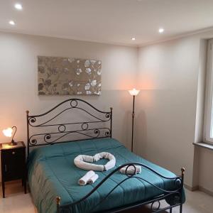 a bedroom with a bed with two towels on it at La Casa del Mugnaio in Rotonda +42 photos