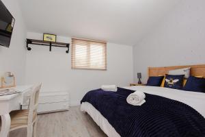 Voodi või voodid majutusasutuse Hunny Cottage - Ryde toas