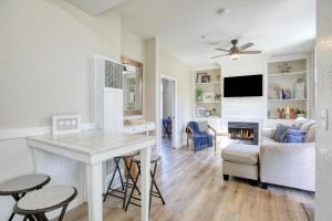 a kitchen and living room with a table and a fireplace at Pacific Plaza #410 - Pacific Coast Hideaway - 1BdrmUp-K in Oceano