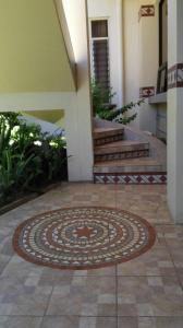 a rug on the floor of a building with stairs at Morada Kampos in Heredia