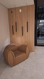 a brown couch sitting in the corner of a room at Skylux 3003 in Rio de Janeiro +20 photos