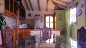 a kitchen with a glass counter top in a room at Rural retreat pool, 6ppl - 5min beach - SuperHost in Mala